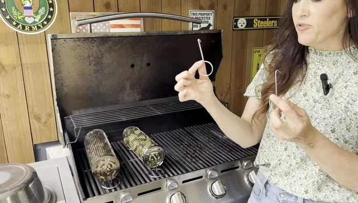 Remove the baskets from the grill using the carrying hooks or by carefully grasping the center.