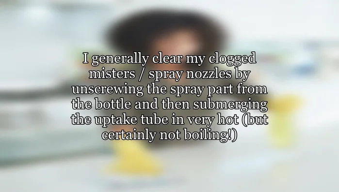 Unscrew the spray nozzle from the bottle.