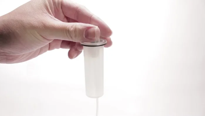 Fill the sprayer halfway with olive oil.