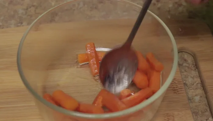 Toss the vegetables gently to distribute the oil evenly.