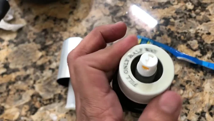 Fill the sprayer halfway with hot water, add a little dish soap, and pump to flush out any remaining residue.