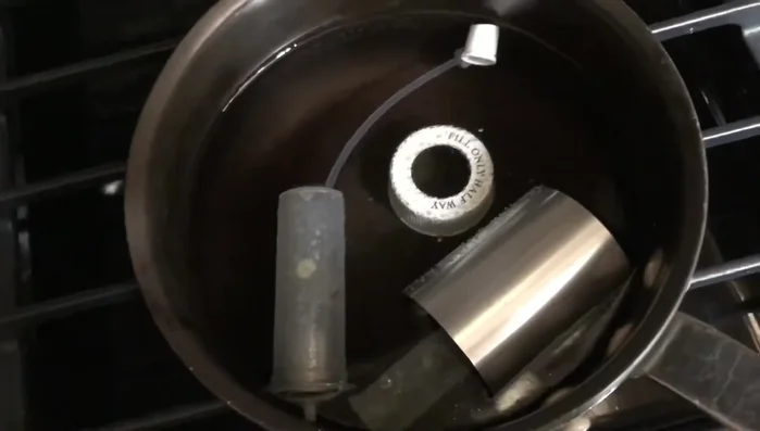 Empty the bottle and put it upside down to clean the head. 