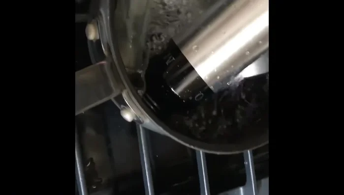 Empty the bottle and put it upside down to clean the head. 