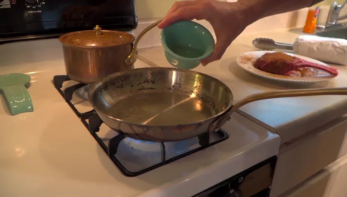 Sear the elk rack, presentation side down, for about 45 seconds until nicely caramelized. Flip and repeat.