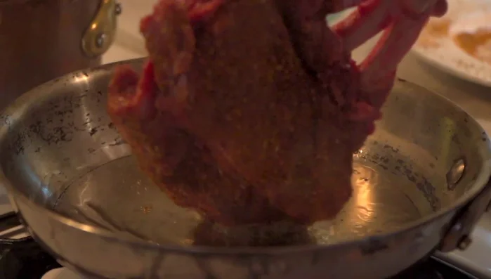 Sear the elk rack, presentation side down, for about 45 seconds until nicely caramelized. Flip and repeat.