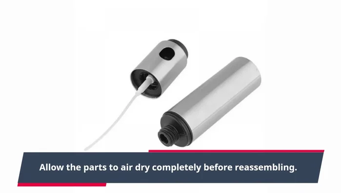 Reassemble the sprayer: put the straw back into the pump and reattach the nozzle.