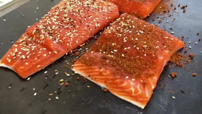 Carefully lift the grill mat and food off the grill using two hands if needed. (For easier transport, use a baking sheet to support the mat)