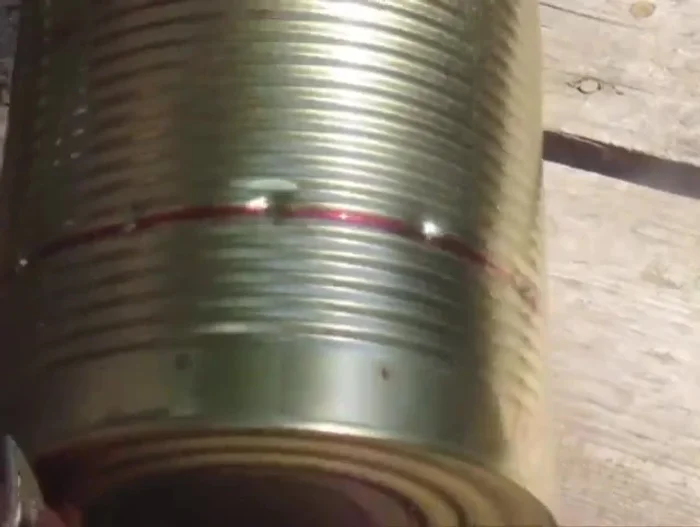 Drill corresponding holes in the can to match the handle's holes. You might need a pilot hole.