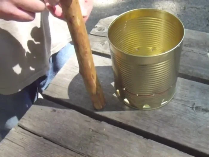 Insert the bolts through the handle and can, securing with three nuts on each side.