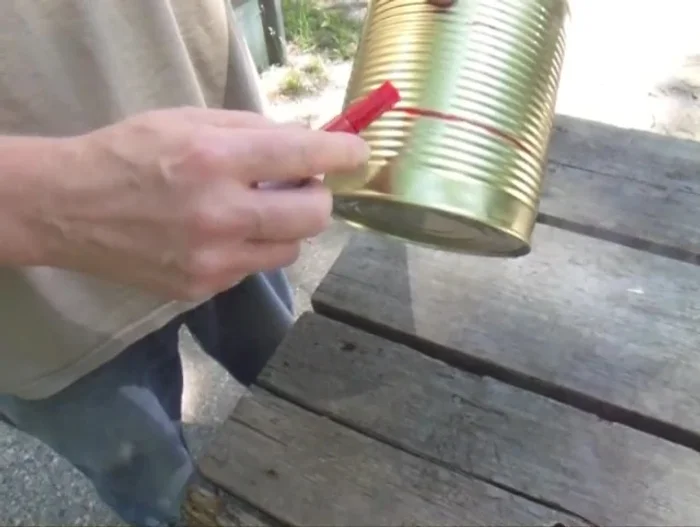 Mark a line about a third of the way up the can. This is where you'll drill holes.