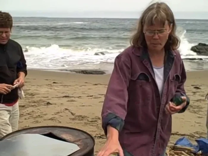 Place a large stick in the middle of the drum to create a chimney effect for better airflow.