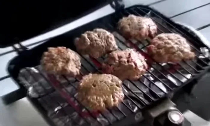 Prepare the grill: Place aluminum foil under the burner for easy cleanup.