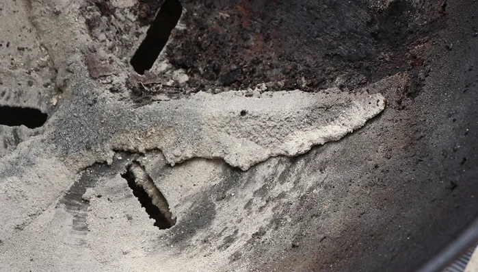 Clean the vent wings, removing any buildup of ash and grease that prevents them from sealing correctly or moving freely.