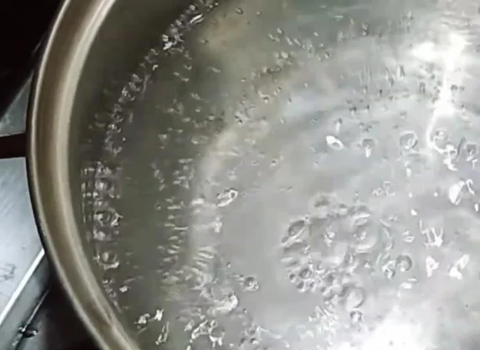 Add vinegar, liquid dish soap (about 2 tablespoons), and baking soda to the boiling water.
