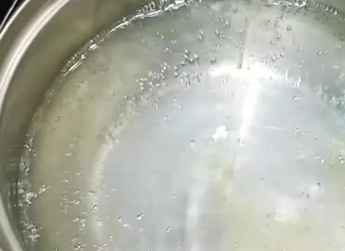 Add vinegar, liquid dish soap (about 2 tablespoons), and baking soda to the boiling water.