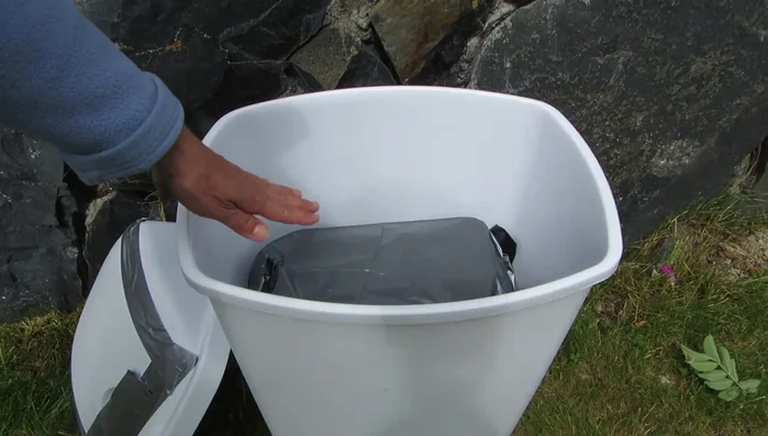 Seal the container with another plastic bag and secure the lid with duct tape.
