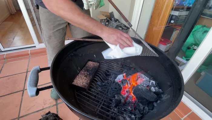Grill the mackerel, oiling it occasionally to maintain moisture and achieve crispy skin. Flip it once the underside is cooked (less than a minute).