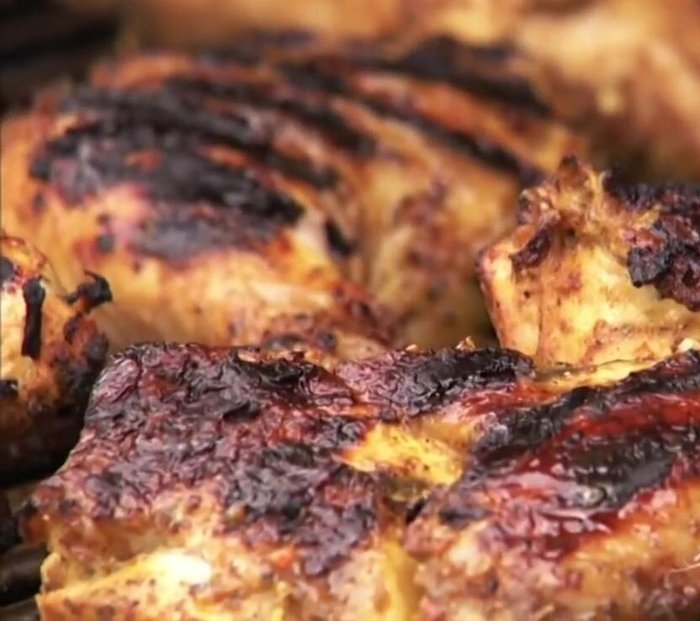 Check for doneness by cutting a small slit; juices should run clear. Alternatively, use an instant-read thermometer inserted into the thickest part (avoiding the bone) to check for an internal temperature of 160-170 degrees.