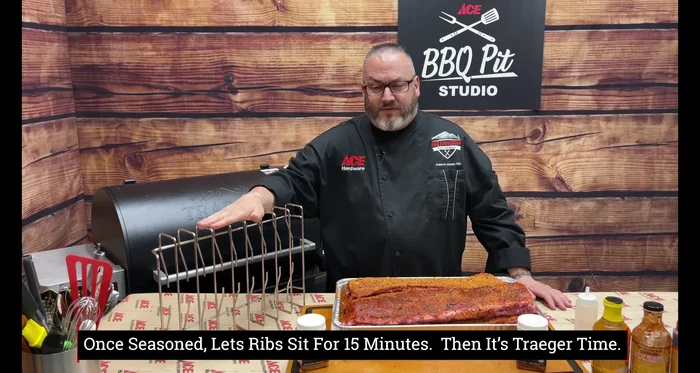 Load the rib rack: Place the seasoned ribs onto the Traeger rib rack.