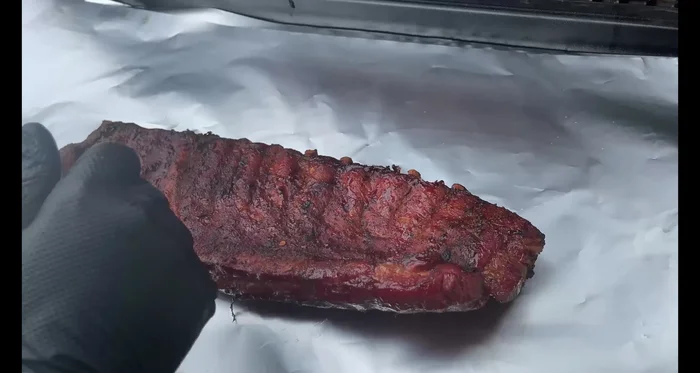 Fall-off-the-bone prep: At the 4-hour mark, for fall-off-the-bone ribs, add butter, brown sugar, and fire honey to the top.