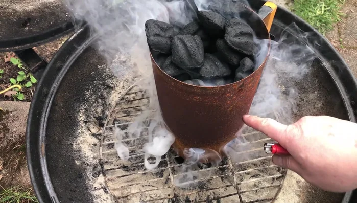 Wait for optimal temperature: Allow the charcoal to burn for approximately 35 minutes until it's ashy on top and red-hot underneath.