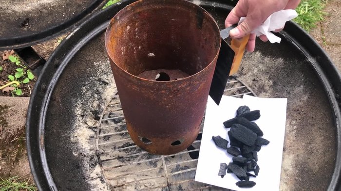 Prepare the chimney starter: Place a coffee filter at the bottom to prevent small lump charcoal pieces from falling through the holes.