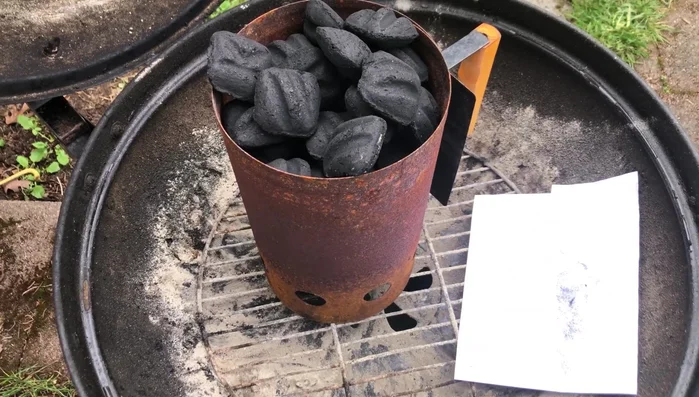 Prepare kindling: Crumple three sheets of 8.5 x 11 paper into balls and lightly spray with oil to slow down the burning process.