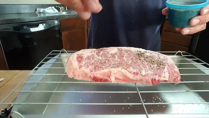 Grill the steak indirectly at 250°F for about 20-30 minutes, until it reaches an internal temperature of 140°F (medium).
