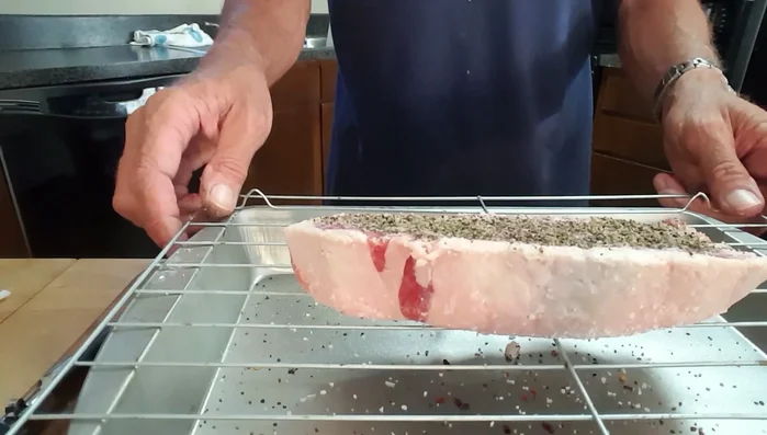 Grill the steak indirectly at 250°F for about 20-30 minutes, until it reaches an internal temperature of 140°F (medium).