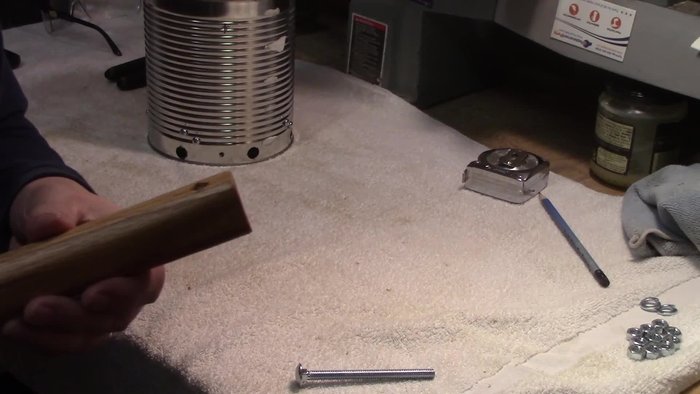 Mark the can to receive the handle and drill holes for the bolts.