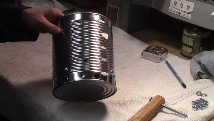 Attach the handle securely using lock washers and nuts (nuts on the inside, flush with the outside).