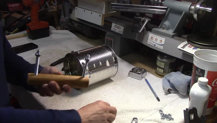 Attach the handle securely using lock washers and nuts (nuts on the inside, flush with the outside).