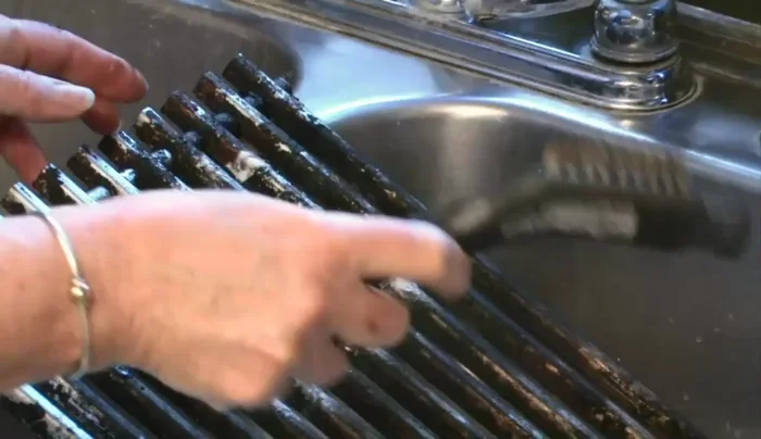 Use the wire brush again to remove loosened debris.