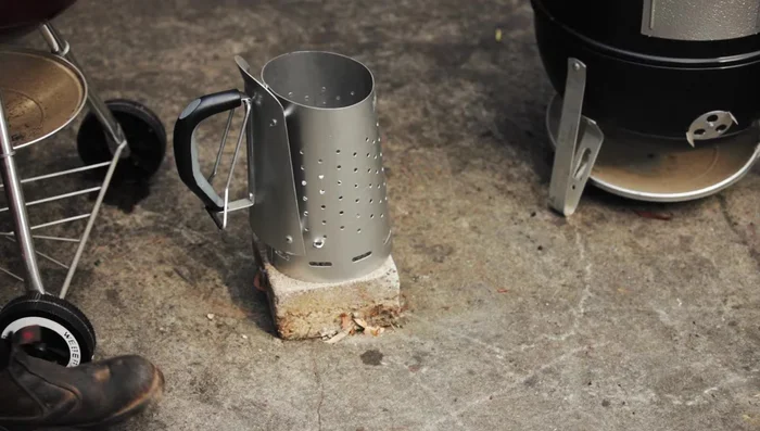 Place the chimney starter on a concrete block to protect your surface.