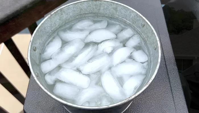 Let excess water drain from the brush head.