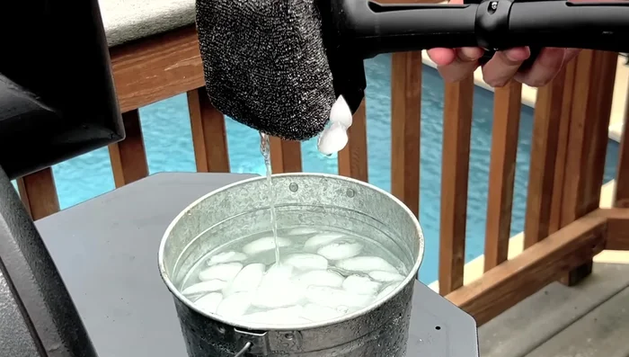 Let excess water drain from the brush head.