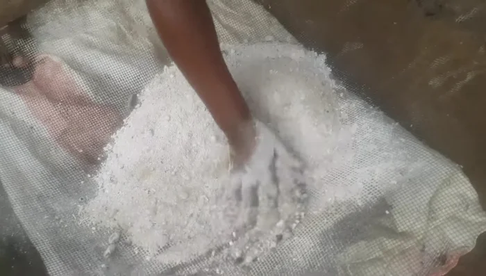 Sieve the ash to remove large particles.