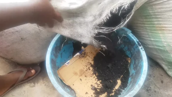 Sieve the ash to remove large particles.