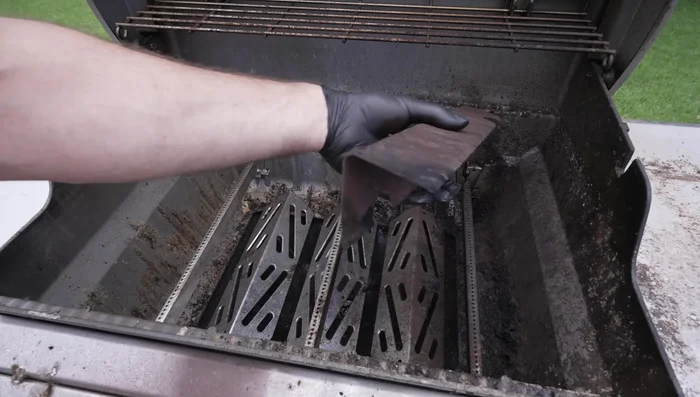 Remove burner tubes by popping them out and disconnect the igniter.