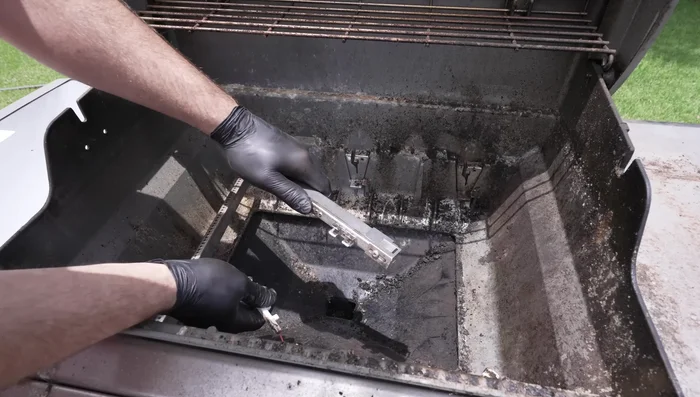 Remove burner tubes by popping them out and disconnect the igniter.