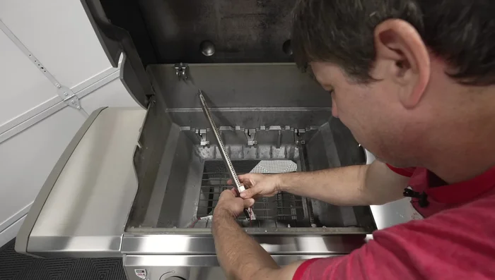 Reassemble the grill.