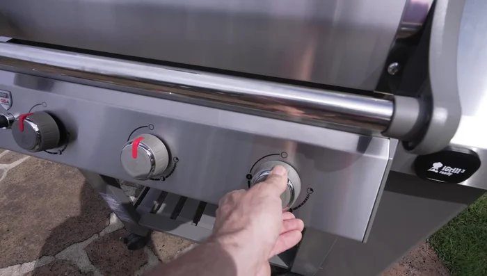 Season grill grates with high-temperature cooking oil.