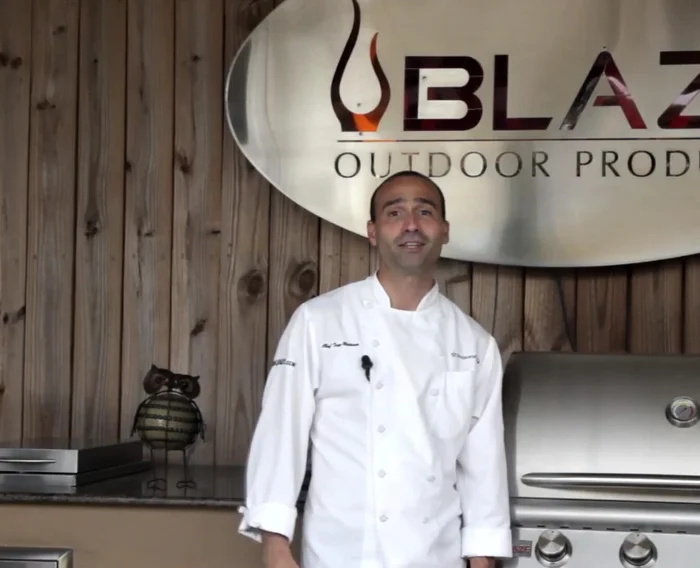 Turn the burner under the smoker box on high. Place a surface thermometer in the opposite rear corner of the grill.