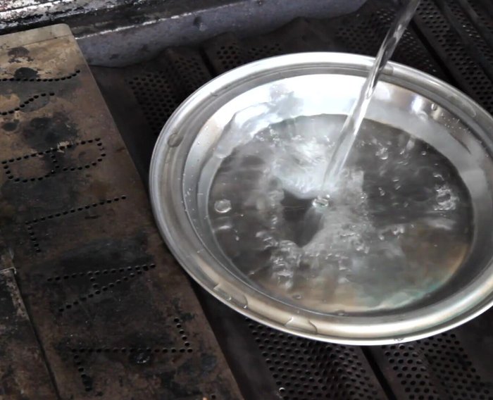 Turn the burner under the smoker box on high. Place a surface thermometer in the opposite rear corner of the grill.