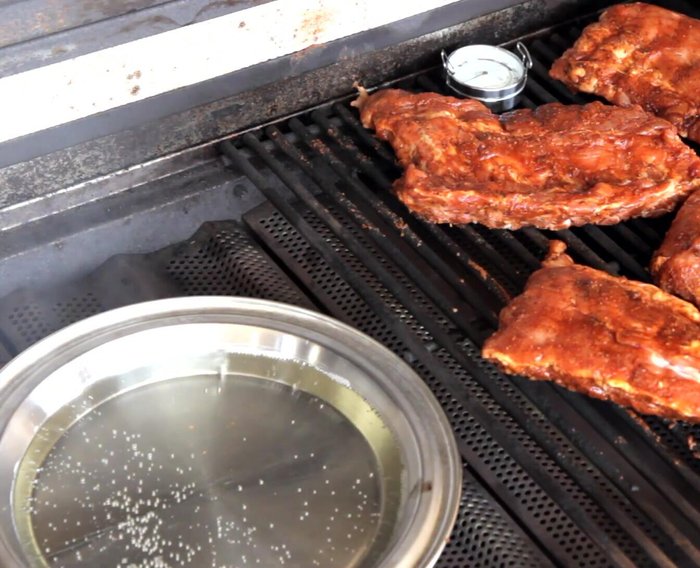 Cook for 1 hour to 1 hour 15 minutes. Replenish smoker box with 4-5 oz of wood chips and refill the water pan.