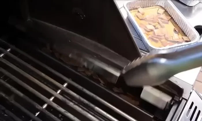 Close the smoker box and grill lid; wait for smoke to appear.