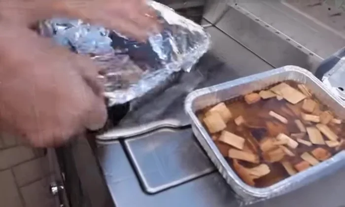 Cover with aluminum foil; poke holes for smoke to escape.
