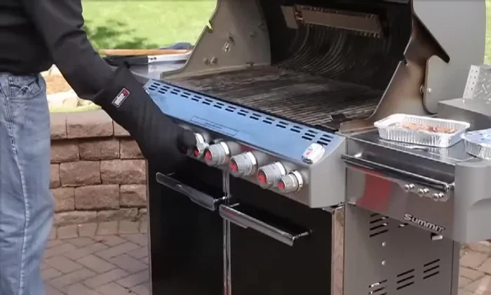 Turn off middle burners; turn down outside burners to the suggested temperature. Keep the burner under the smoker box on high.