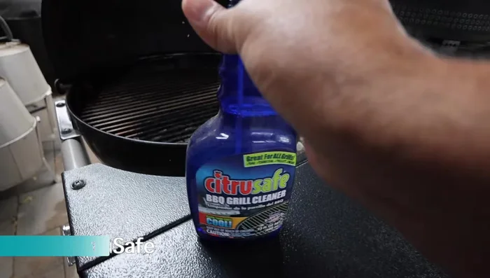 Spray Citrus Safe Grill Cleaner onto the cold grill grates in two directions to cover more surface area.