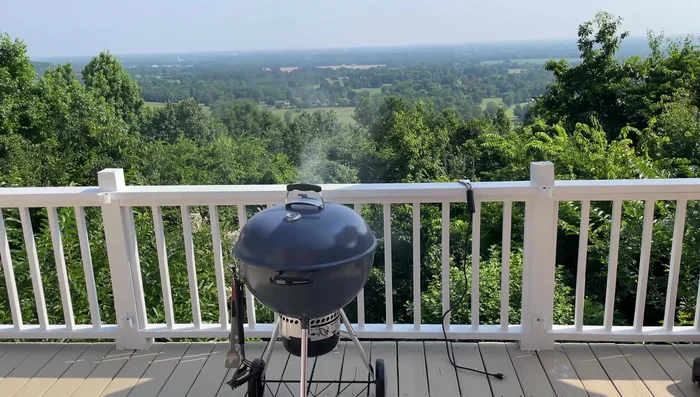 Weber Master Touch charcoal grill on deck